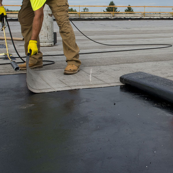 modified bitumen commercial roofing system being installed on an NKY building by AnyWeather Roofing